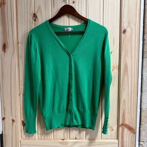 Cielo v-neck cardigan with long sleeves and decorative buttons on the cuffs.